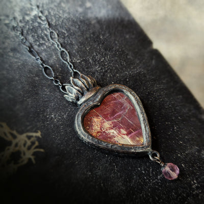 astraea - a sacred heart amulet