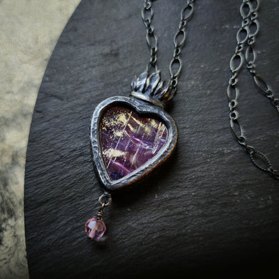 astraea - a sacred heart amulet