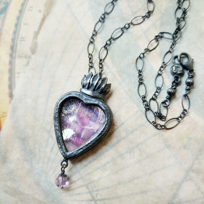 astraea - a sacred heart amulet