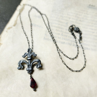 fleur de lis amulet - antiqued sterling with garnet