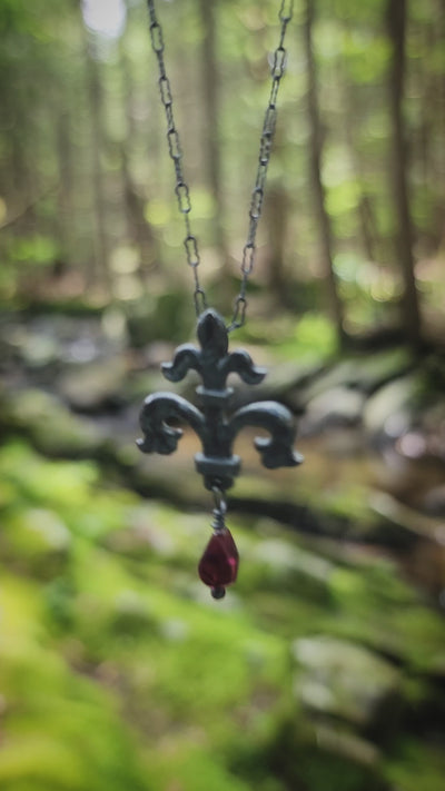 fleur de lis amulet - antiqued sterling with garnet