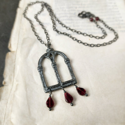 crowned queen isabella window amulet - antiqued sterling garnet