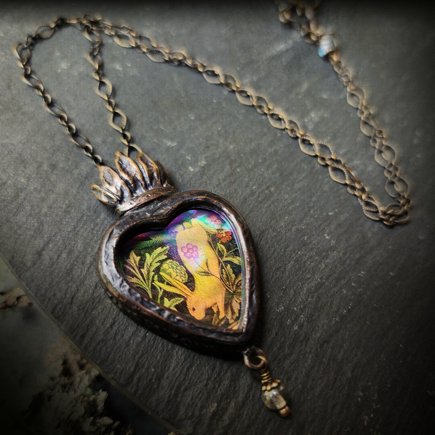 the hare is running races in her mirth; - sacred heart amulet