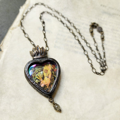 the hare is running races in her mirth; - sacred heart amulet